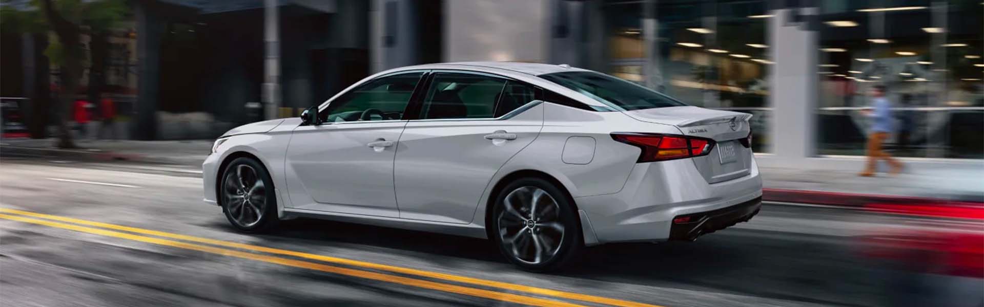 2025 Nissan Altima at Nissan of Canton in white driving on road