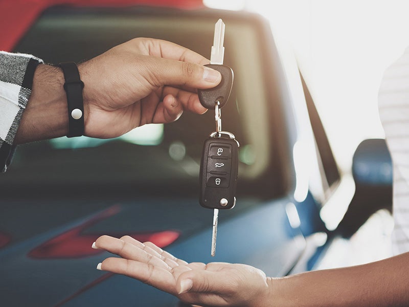 Nissan of Canton in Canton MI college grads getting new car keys