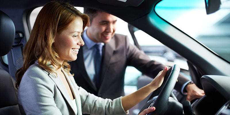 Nissan of Canton in Canton MI customer sitting in a new car