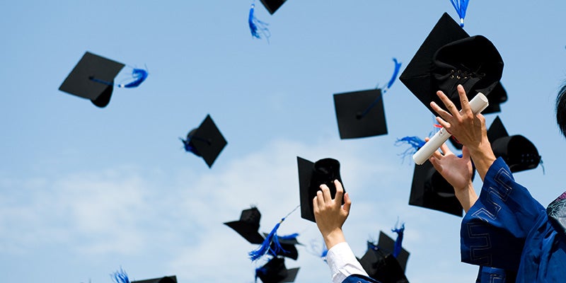 Nissan of Canton in Canton MI graduation caps thrown in air