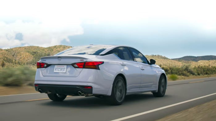 Nissan of Canton in Canton MI Nissan Altima rear view driving on road
