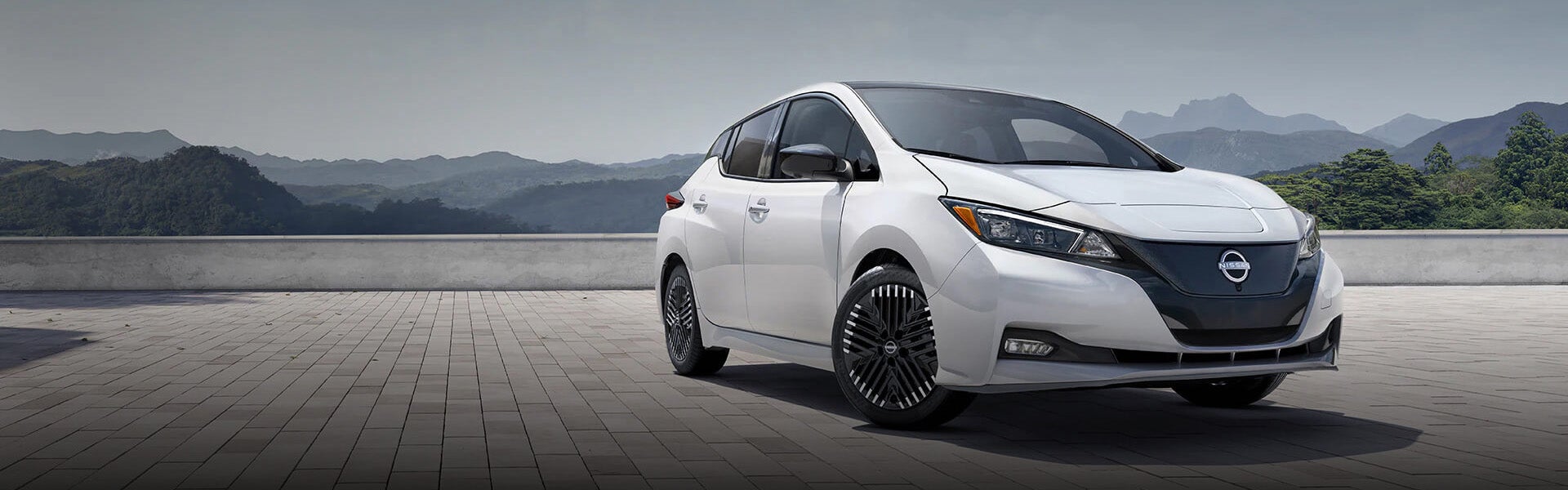 2025 Nissan LEAF<sup>&reg;</sup> at Nissan of Canton parked on architectural building