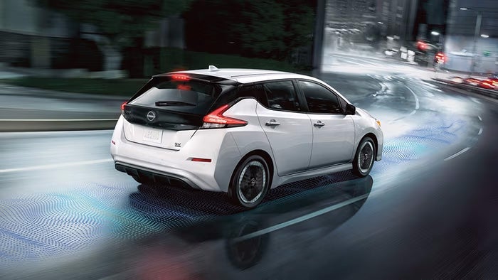 Nissan of Canton in Canton MI Nissan LEAF driving downtown at night