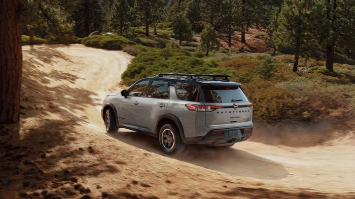 Nissan of Canton in Canton MI Nissan Pathfinder driving on a dirt road