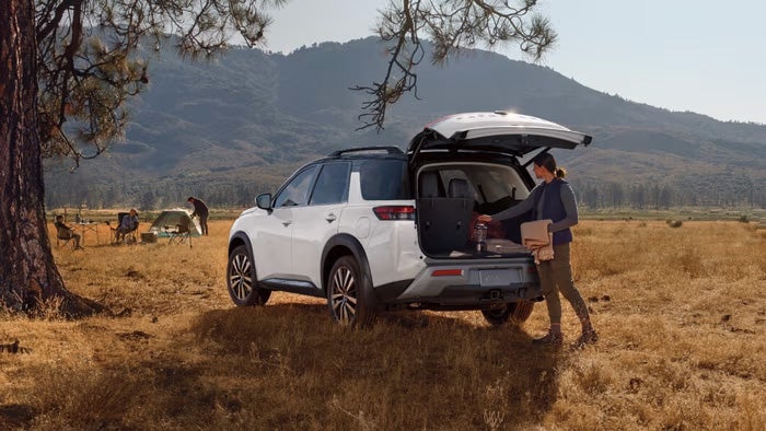 Nissan of Canton in Canton MI Nissan Pathfinder being loaded with luggage by a camper